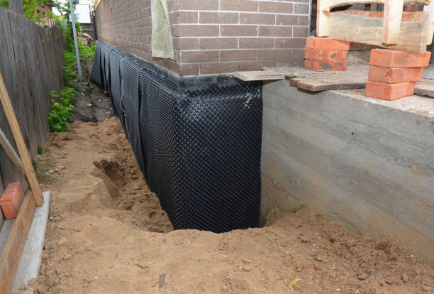 SJ Waterproofing Pros technician performing targeted Interior Drainage System assessment in Delafield, WI